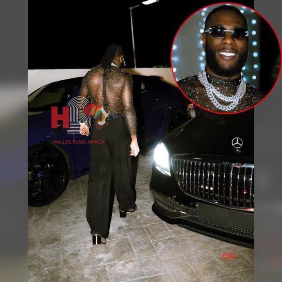 A Nigerian jollof rapper Burna Boy’s picture was taken allegedly in one of Diddy baby oil parties wearing a prostitute outfit with block hills.